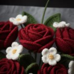 Handcrafted Elegance: Woolen Rose & Daisy Bouquet - Timeless Charm (5 Red Roses, 5 White Daisies, Black Wrap, Red Ribbon)